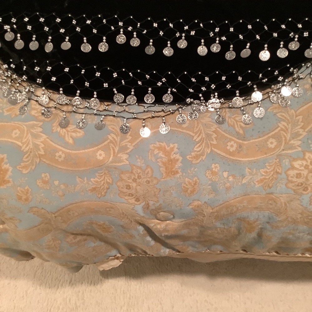 Velvet sarong decorated with silver triple row coins. New condition